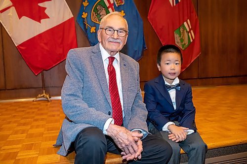 BROOK JONES/FREE PRESS
The Winnipeg Boys Choir is celebrating its centennial this year. Winnipeg Boys Choir alumni Jim Shephered (left), who sang in the choir from 1942 to 1945, is pictured with the choir's youngest member Oakley Guo at at Government House in Winnipeg, Man., Thursday, Oct. 10, 2024. The local choir performed for Lt.-Gov. Anita Neville in celebration of their centennial milestone.