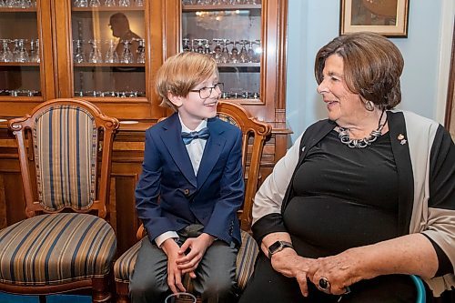 BROOK JONES/FREE PRESS
The Winnipeg Boys Choir is celebrating its centennial this year. Winnipeg Boys Choir member Charlie Pulford, 9, (left) is pictured visiting with Manitoba Lt.-Gov. Anita Neville at Government House in Winnipeg, Man., Thursday, Oct. 10, 2024. The local choir performed for the lieutenant-governor in celebration of their centennial milestone.