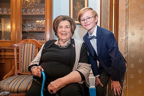 BROOK JONES/FREE PRESS
The Winnipeg Boys Choir is celebrating its centennial this year. Winnipeg Boys Choir member Charlie Pulford, 9, (right) is pictured with Manitoba Lt.-Gov. Anita Neville at Government House in Winnipeg, Man., Thursday, Oct. 10, 2024. The local choir performed for the lieutenant-governor in celebration of their centennial milestone.