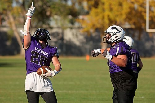 11102024
Brayden Smith #28 of the Vincent Massey Vikings throws a finger up to the sky while celebrating a touchdown during high school varsity football action against the River East Kodiaks at VMHS on a beautiful Friday afternoon. 
(Tim Smith/The Brandon Sun)