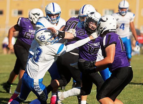 11102024
Quarterback Coleton Malyon #10 of the Vincent Massey Vikings tries to break free from Elliot Falk #3 of the River East Kodiaks while running the ball during high school varsity football action against the River East Kodiaks at VMHS on a beautiful Friday afternoon. 
(Tim Smith/The Brandon Sun)