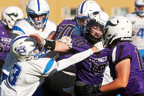 11102024
Quarterback Coleton Malyon #10 of the Vincent Massey Vikings tries to break free from Elliot Falk #3 of the River East Kodiaks while running the ball during high school varsity football action against the River East Kodiaks at VMHS on a beautiful Friday afternoon. 
(Tim Smith/The Brandon Sun)