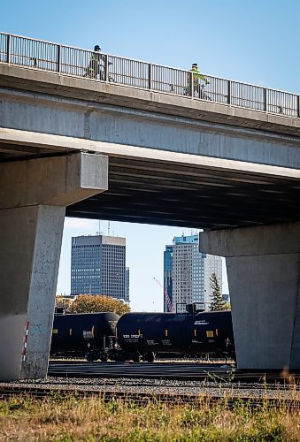 JOHN WOODS / FREE PRESS
Cyclists cross the Salter Street Bridge to get over the rail-yard in downtown Winnipeg Monday, October 14, 2024. 

Reporter: ?