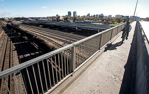 JOHN WOODS / FREE PRESS
A cyclist crosses the Salter Street Bridge to get over the rail-yard in downtown Winnipeg Monday, October 14, 2024. 

Reporter: ?