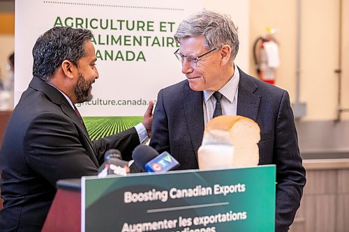 MIKAELA MACKENZIE / FREE PRESS
	
Terry Duguid, MP for Winnipeg South (right), and Dean Dias, CEO of Cereals Canada, shake hands at an announcement of investments in Canadian cereals at the Cereals Canada Pasta Lab on Tuesday, Oct. 15, 2024.

For Martin Cash story.
Winnipeg Free Press 2024