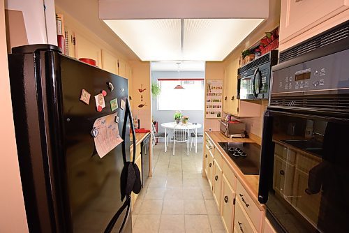 Todd Lewys / Free Press
A functional galley kitchen with built-in cooktop opens neatly onto a quaint eating nook.