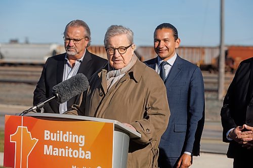 MIKE DEAL / FREE PRESS
Premier Wab Kinew announces that his government has selected selecting Lloyd Axworthy as study lead to determine the feasibility of relocating Winnipeg&#x2019;s rail lines, during a press conference at the edge of the Canadian Pacific Railway rail yards, Tuesday morning.
Reporter: Chris Kitching
241015 - Tuesday, October 15, 2024.