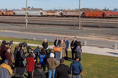 MIKE DEAL / FREE PRESS
Premier Wab Kinew announces that his government has selected selecting Lloyd Axworthy as study lead to determine the feasibility of relocating Winnipeg&#x2019;s rail lines, during a press conference at the edge of the Canadian Pacific Railway rail yards, Tuesday morning.
Reporter: Chris Kitching
241015 - Tuesday, October 15, 2024.