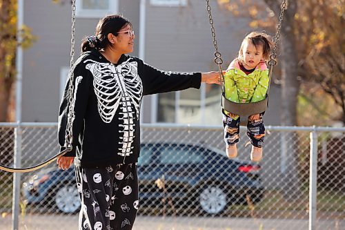 15102024
Mary Castel pushes her daughter Korra Welburn, almost two, on a swing at the park across from the Park Community Centre in Brandon on a sunny Tuesday.
(Tim Smith/The Brandon Sun)