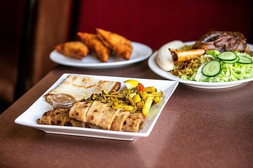 MIKAELA MACKENZIE / FREE PRESS
	
Beef suqaar stew with chapati, lamb shank and rice, and beef samosas at Som Legacy Restaurant on Tuesday, Oct. 15, 2024.

For Eva story.
Winnipeg Free Press 2024