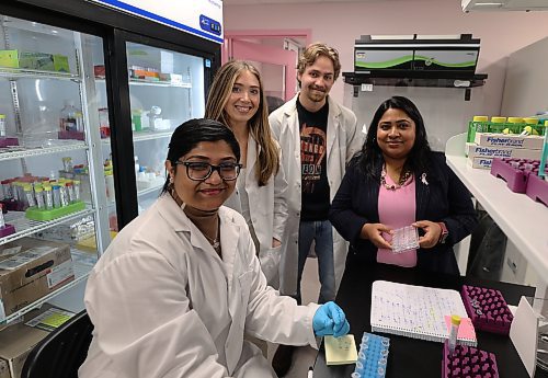 Shamima Anonna (left), an international master's student, honours student Beatrice Gatien, master's of science student Reid Opperman and Dr. Mousumi Majumder, professor and Canada Research Chair, pose for a photo in the Breast Cancer Cell and Molecular Research Laboratory at Brandon University. (Michele McDougall/The Brandon Sun)