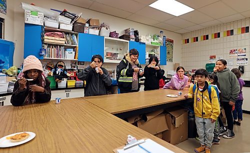 Students at Betty Gibson School enjoy a breakfast provided to them through the Food for Thought program on Wednesday morning that included fruit, yogurt and pizza buns. (Colin Slark/The Brandon Sun)