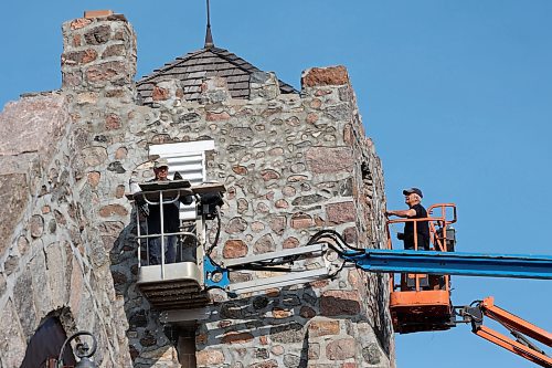 Rudy Leroy with Leroy Masonry and Rocky Siemens with Siemens Construction work on replacing wood vents on St. Mary’s Anglican Church in Virden. Construction of the stone church began in 1892. (Tim Smith/The Brandon Sun) 