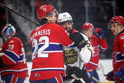 Brandon callup Prabh Bhathal and Spokane's Hayden Paupanekis share a laugh during a stoppage in play. (Tim Smith/The Brandon Sun)