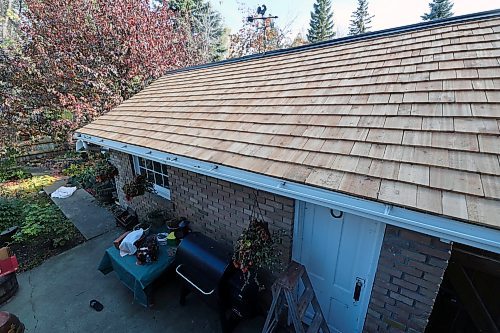 A 560-square-foot Brandon rooftop is lined with cedar shingles. The shingles were cut from old hydro poles, after the homeowner put out a request to Neil Friesen, a woodworker out of Wawanesa who repurposes poles for artisan projects. The homeowner told the Sun he had to twist some arms to get the project taken up, as the shingles take a long time to cut. (Connor McDowell/Brandon Sun)