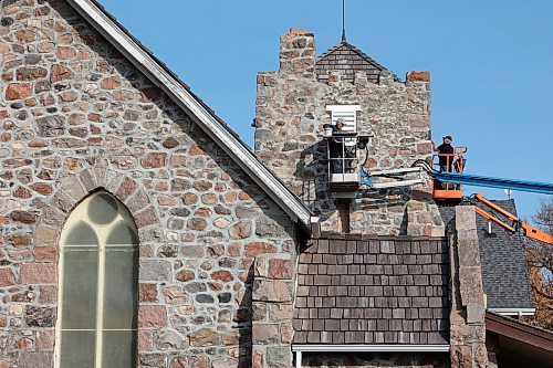 15102024
Rudy Leroy with Leroy Masonry and Rocky Siemens with Siemens Construction work on replacing wood vents on St. Mary&#x2019;s Anglican Church in Virden. Construction of the stone church began in 1892. 
(Tim Smith/The Brandon Sun) 