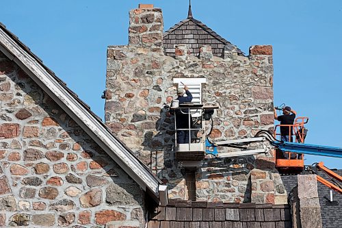 15102024
Rudy Leroy with Leroy Masonry and Rocky Siemens with Siemens Construction work on replacing wood vents on St. Mary&#x2019;s Anglican Church in Virden. Construction of the stone church began in 1892. 
(Tim Smith/The Brandon Sun) 