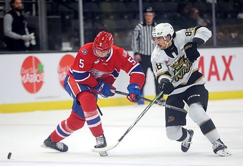 15102024
Matteo Michels #88 of the Brandon Wheat Kings slips the puck past Nathan Mayes #5 of the Spokane Chiefs during WHL action at Westoba Place on Wednesday evening.
(Tim Smith/The Brandon Sun) 