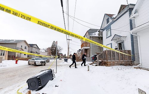 MIKE DEAL / FREE PRESS
Winnipeg Police Service forensic officers enter 259 Magnus Avenue where there was an officer involved shooting Tuesday morning.
240214 - Wednesday, February 14, 2024.