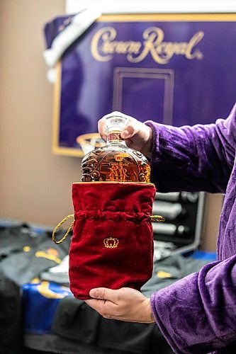 MIKAELA MACKENZIE / FREE PRESS
Marc Andre shows off a bottle from his Crown Royal whisky collection.