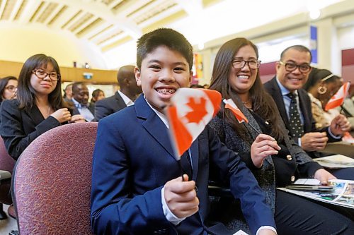 MIKE DEAL / FREE PRESS
Marcus Gonzales, 11, waves his Canadian flag after giving his oath of citizenship along with his father, Marchelle (right), mother Lylanie (second from right), and sister, Margaret (left).
Marc Miller, Minister of Immigration, Refugees and Citizenship, was on hand to welcome 79 of Canada's newest citizens from 15 different countries at a ceremony in Winnipeg, presided over by Citizenship Judge Suzanne Carri&#xe8;re.
Reporter: Tyler Searle
241017 - Thursday, October 17, 2024.