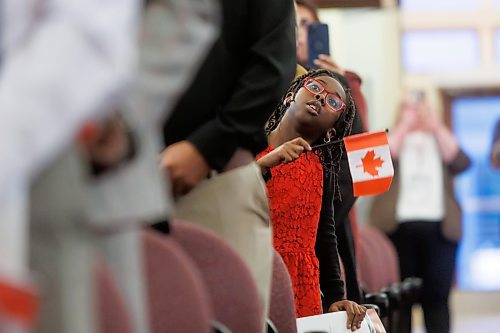 MIKE DEAL / FREE PRESS
Tofunmi Olukanye-David, 8, waves her Canadian flag after becoming a Canadian citizen Thursday morning.
Marc Miller, Minister of Immigration, Refugees and Citizenship, was on hand to welcome 79 of Canada's newest citizens from 15 different countries at a ceremony in Winnipeg, presided over by Citizenship Judge Suzanne Carri&#xe8;re.
Reporter: Tyler Searle
241017 - Thursday, October 17, 2024.