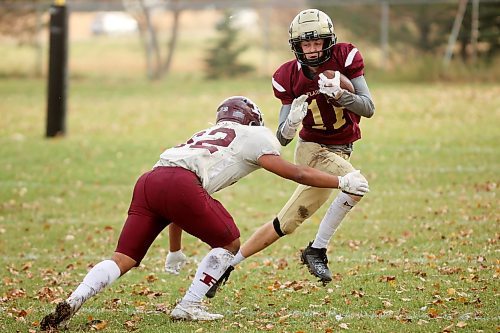 Quarterback Simon Leckie (11) of the Crocus Plainsmen runs the ball during high school football action against the St. Paul’s Crusaders at CPRSS on a warm Thursday. (Photos by Tim Smith/The Brandon Sun)