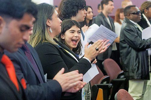 MIKE DEAL / FREE PRESS
Josefa Cueto, 11, cheers after making her oath of citizenship with the rest of her family, Thursday morning.
Marc Miller, Minister of Immigration, Refugees and Citizenship, was on hand to welcome 79 of Canada's newest citizens from 15 different countries at a ceremony in Winnipeg, presided over by Citizenship Judge Suzanne Carri&#xe8;re.
Reporter: Tyler Searle
241017 - Thursday, October 17, 2024.