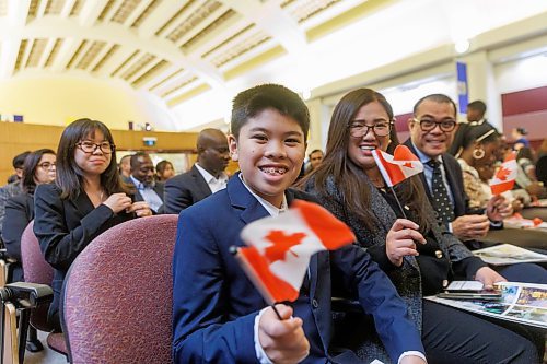 MIKE DEAL / FREE PRESS
Marcus Gonzales, 11, waves his Canadian flag after giving his oath of citizenship along with his father, Marchelle (right), mother Lylanie (second from right), and sister, Margaret (left).
Marc Miller, Minister of Immigration, Refugees and Citizenship, was on hand to welcome 79 of Canada's newest citizens from 15 different countries at a ceremony in Winnipeg, presided over by Citizenship Judge Suzanne Carri&#xe8;re.
Reporter: Tyler Searle
241017 - Thursday, October 17, 2024.