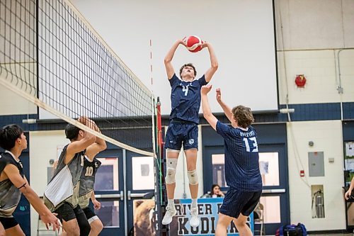 BROOK JONES / FREE PRESS
The River East Kodiaks varsity boys volleyball team earned a victory over the visiting Garden City Gophers in three straight sets (26-24, 25-14, 25-18-) in AAAA KPAC Tier 1 volleyball action at River East Collegiate in Winnipeg, Man., Wednesday, Oct. 16, 2024. Pictured: River East Kodiaks player Matthew Brown (No. 4) sets the volleyball for teammate Nikolas Horton. (No. 13).