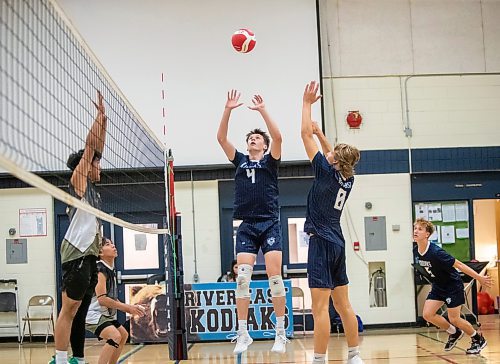 BROOK JONES / FREE PRESS
The River East Kodiaks varsity boys volleyball team earned a victory over the visiting Garden City Gophers in three straight sets (26-24, 25-14, 25-18-) in AAAA KPAC Tier 1 volleyball action at River East Collegiate in Winnipeg, Man., Wednesday, Oct. 16, 2024. Pictured: River East Kodiaks player Matthew Brown (No. 4) sets the volleyball for teammate Tanner Naghtigall (No. 8), who plays middle.