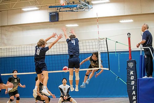 BROOK JONES / FREE PRESS
The River East Kodiaks varsity boys volleyball team earned a victory over the visiting Garden City Gophers in three straight sets (26-24, 25-14, 25-18-) in AAAA KPAC Tier 1 volleyball action at River East Collegiate in Winnipeg, Man., Wednesday, Oct. 16, 2024. Pictured: River East Kodiaks Tanner Naghtigall (No. 8), who plays middle, and teammate Matthew Brown (No. 4), who is a setter, block the volleyball.