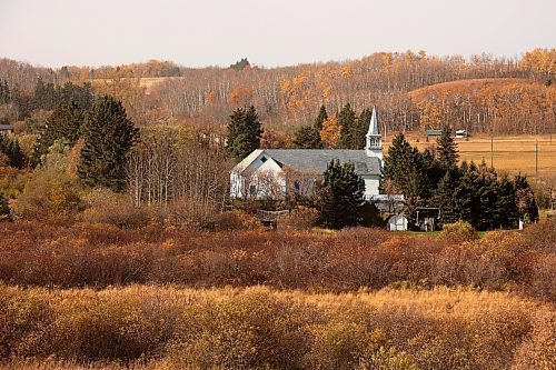 17102024
St. Elizabeth of Hungary Church in Polonia, Manitoba stands out against the fall colours in the valley on a warm 
Thursday.
(Tim Smith/The Brandon Sun)