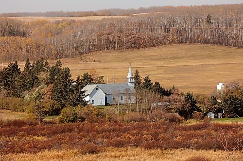 17102024
St. Elizabeth of Hungary Church in Polonia, Manitoba stands out against the fall colours in the valley on a warm 
Thursday.
(Tim Smith/The Brandon Sun)