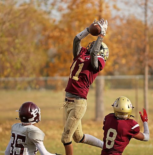 17102024
Quarterback Simon Leckie #11 of the Crocus Plainsmen catches the ball for an interception during high school football action against the St. Paul&#x2019;s Crusaders at CPRSS on a warm Thursday. 
(Tim Smith/The Brandon Sun)