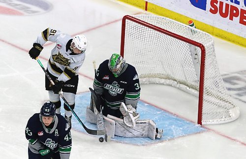 Brandon Wheat Kings forward Nolan Flamand (91) tries to get the puck past Seattle Thunderbirds goalie Scott Ratzlaff (33) behind defenceman Sawyer Mynio (43) during the third period in Western Hockey League action at Westoba Place on Friday. (Perry Bergson/The Brandon Sun)
Oct. 18, 2024