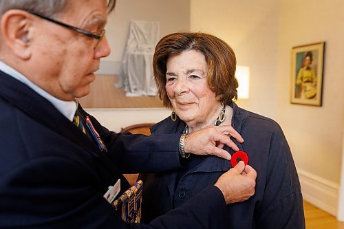 MIKE DEAL / FREE PRESS
Lt.-Gov. Anita R. Neville is presented with the first poppy of this year&#x2019;s annual Royal Canadian Legion fundraiser at Government House, 10 Kennedy St. by Comrade Ernie Tester, president, Royal Canadian Legion Provincial Command, Friday morning.
241018 - Friday, October 18, 2024.