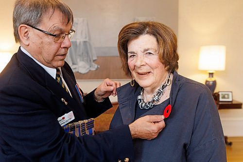 MIKE DEAL / FREE PRESS
Lt.-Gov. Anita R. Neville is presented with the first poppy of this year&#x2019;s annual Royal Canadian Legion fundraiser at Government House, 10 Kennedy St. by Comrade Ernie Tester, president, Royal Canadian Legion Provincial Command, Friday morning.
241018 - Friday, October 18, 2024.