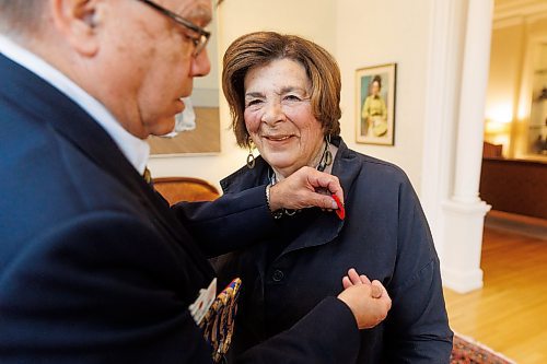 MIKE DEAL / FREE PRESS
Lt.-Gov. Anita R. Neville is presented with the first poppy of this year&#x2019;s annual Royal Canadian Legion fundraiser at Government House, 10 Kennedy St. by Comrade Ernie Tester, president, Royal Canadian Legion Provincial Command, Friday morning.
241018 - Friday, October 18, 2024.