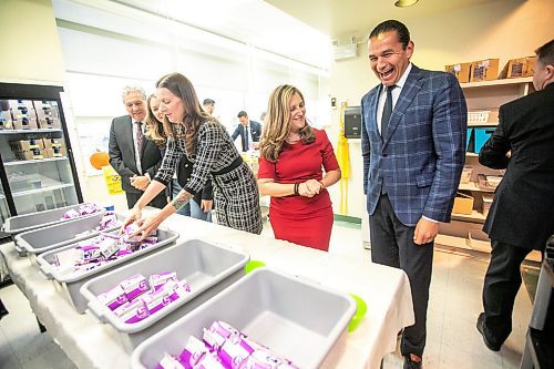 MIKAELA MACKENZIE / FREE PRESS
	
MLA Tracy Schmidt (left), deputy prime minister Chrystia Freeland, and premier Wab Kinew pack snack bins for Marion School classrooms on Friday, Oct. 18, 2024.

For Maggie story.
Winnipeg Free Press 2024