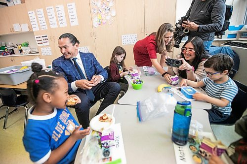 MIKAELA MACKENZIE / FREE PRESS
	
Premier Wab Kinew and deputy prime minister Chrystia Freeland serve snacks to Marion School kindergarten students on Friday, Oct. 18, 2024.

For Maggie story.
Winnipeg Free Press 2024