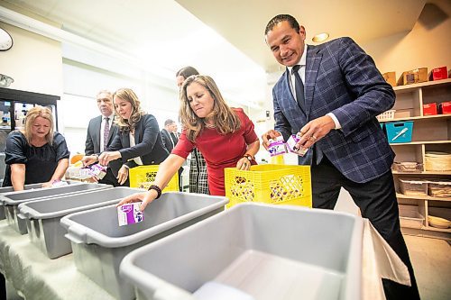 MIKAELA MACKENZIE / FREE PRESS
	
Deputy prime minister Chrystia Freeland (left) and premier Wab Kinew pack snack bins for Marion School classrooms on Friday, Oct. 18, 2024.

For Maggie story.
Winnipeg Free Press 2024