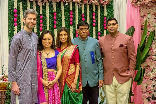 BROOK JONES/FREE PRESS
The Hindu Society of Manitoba hosts its annual Diwali Mela (Festival of Lights) at the RBC Convention Centre in Winnipeg, Man. Saturday, Oct. 19, 2024. Pictured: Hindu Society of Manitoba President Kirit Thakrar (second from far right) and his son, Shameel Thakrar (far right), are both wearing a nehru jacket, Winnipeg Airports Authority President Nick Hays (far left) is wearing a kurta pajama and his wife Ren Hays (second from far left) is wearing a lehenga choli and Bhawna Thakrar (middle) is draped in a traditional sari.