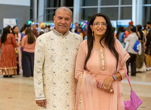 BROOK JONES/FREE PRESS
The Hindu Society of Manitoba hosts its annual Diwali Mela (Festival of Lights) at the RBC Convention Centre in Winnipeg, Man. Saturday, Oct. 19, 2024. Pictured: Jagmohan Wadhawan (left) is wearing a sherwani and Nitga Wadhawan is wearing a modern lehenga choli.