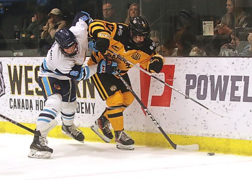 Brandon Wheat Kings forward Roan Michalchuk (17) and Winnipeg Thrashers defenceman Kaden Sutherland (6) battle for the puck in Manitoba U18 AAA Hockey League action at J&amp;G Homes Arena on Saturday. (Perry Bergson/The Brandon Sun)
Oct. 21, 2024