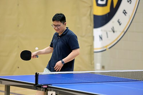 More than 50 table tennis players of various ages gathered at Brandon University's Healthy Living Centre on Saturday to compete in singles and doubles tournaments as part of the Manitoba Table Tennis Association's MBLL Assiniboine Open event. Organizers said it was the biggest table tennis event held in Brandon in years. (Colin Slark/The Brandon Sun)