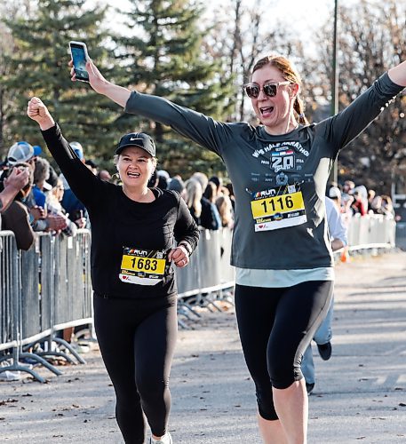 JOHN WOODS / FREE PRESS
People cross the finish line at the WFPS Run at the Canadian Mennonite University Sunday, October 20, 2024. 

Reporter: s/u