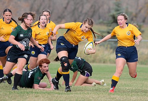 BU's Eden Tabin breaks a tackle against the University of Saskatchewan in Prairie University Women's Rugby Conference action on Saturday. (Thomas Friesen/The Brandon Sun)