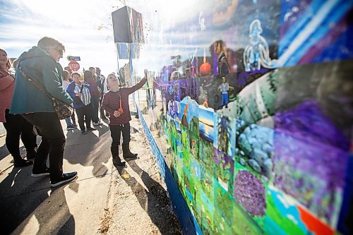 MIKAELA MACKENZIE / FREE PRESS
	
Theo Allen, five, checks out the Canada Connects Love &amp; Family mosaic mural at the unveiling at 1797 Portage Avenue on Monday, Oct. 21, 2024.

For biz story.
Winnipeg Free Press 2024