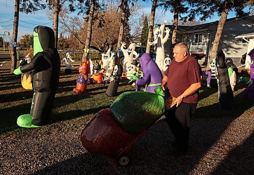 21102024
Tom Muir organizes his extensive Halloween display in the front yard of his home on Lyndale Drive on a beautiful Monday afternoon. Muir has been decorating his home for 23 years and as soon as the Halloween decorations come down, he puts up an equally impressive Christmas display.
(Tim Smith/The Brandon Sun)